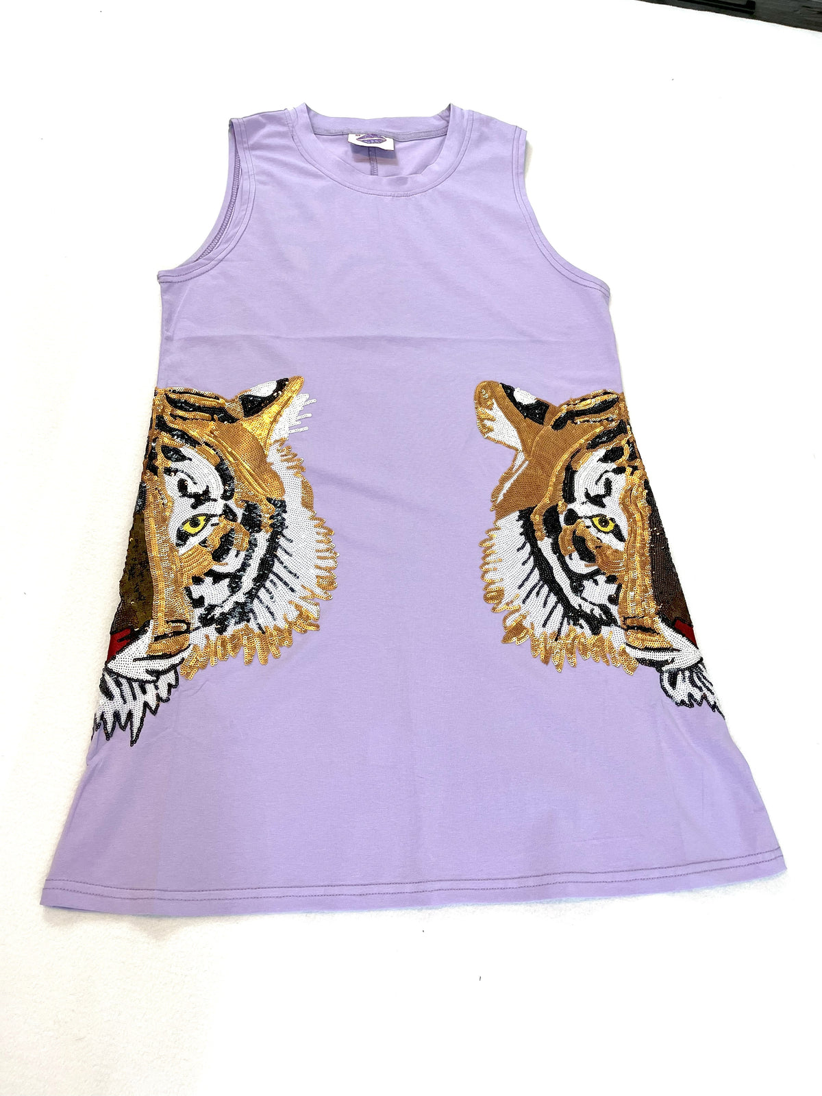 “A lavender tank dress with two sequin tiger heads on the side, representing the Louisiana State University mascot by Sparkle City”